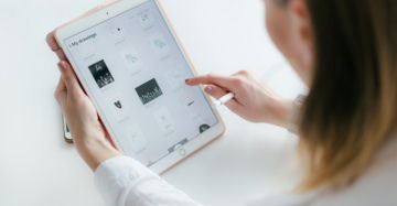 woman using gold iPad