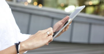 person holding iPad