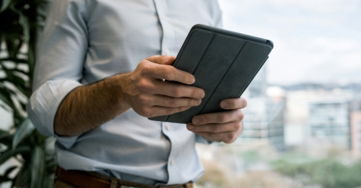 person holding black smart cover during daytime